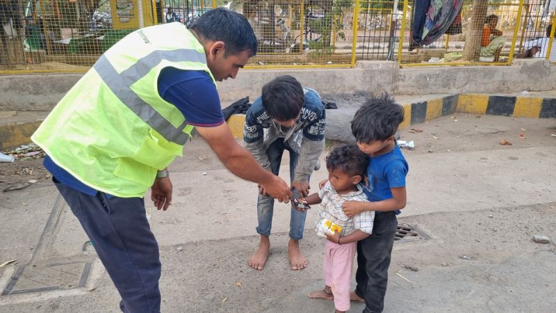 Distribution of Biscuits and Frooti to Children Near Ranchi Railway Station, Jharkhand